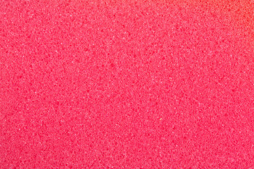 Red cleaning sponge.Texture close up.