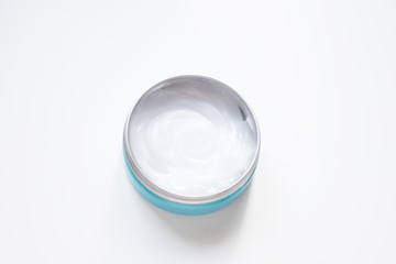 Jar with white cream for hands, face, body, top view