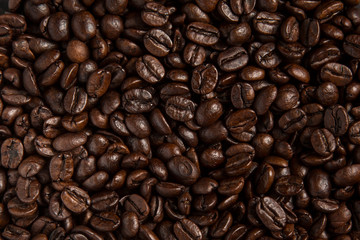 Closeup of coffee beans background, seen from above.