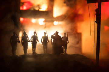 War Concept. Military silhouettes fighting scene on war fog sky background, World War Soldiers...