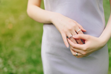 Fototapeta na wymiar elegant thin hand of a girl with a ring close up