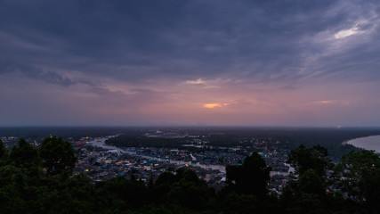 Pak Nam Chumphon town, fisherman village, and river from Khao Matsee scenic viewpoint during twilight