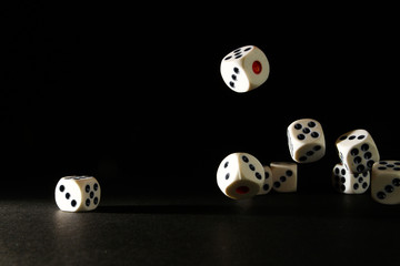 Dice are small, throwable objects with uniquely marked sides that can rest in multiple positions.