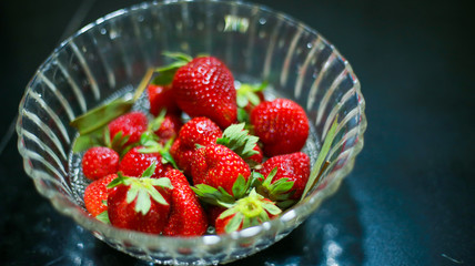Group of strawberry in glass bowl  Red colour fruit