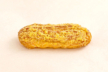 Eclair cake, delicious pastries closeup on a light background