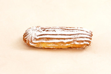 Eclair cake, delicious pastries closeup on a light background