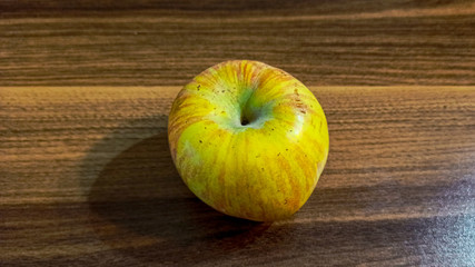 Fresh green and red apple fruit alone on the wooden table 
