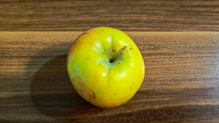 Fresh green and red apple fruit alone on the wooden table 