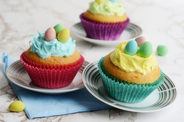 closeup easter cupcakes on small plates