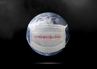On planet earth, a medical mask to protect against the coronavirus epidemic. Concept of a global virus epidemic, concept of Corona virus quarantine, Covid-19. Elements of this image furnished by NAZA