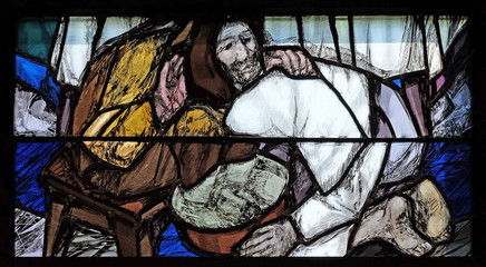 Obraz premium God begins salvation in this world through His Son Jesus Christ, detail of stained glass window by Sieger Koder in St. John church in Piflas, Germany