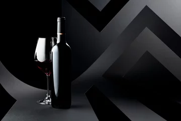 Gordijnen Bottle and glass of red wine on a dark background. © Igor Normann