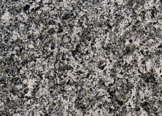 Natural magmatic granite rock dotted grains texture with black and white minerals