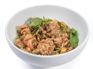 The close up of Spicy minced pork salad in white bowl on white table.