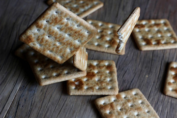 texture cookies on a blurry background falling on a wooden table