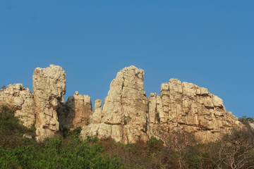 Fototapeta na wymiar Mountain rocks on blue sky background.Mountain scene