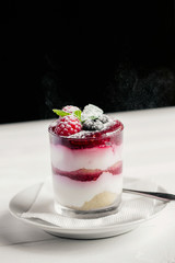 Dessert with strawberries and cream. 