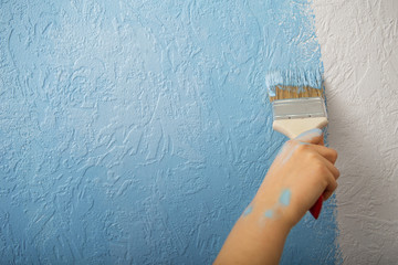 Change in new home girls paints with brush