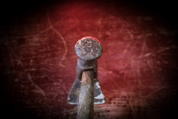 Tool work concept. hammer and nails on dark table