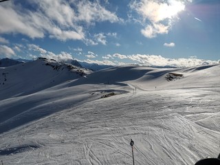 Skiing slope in sunlight, pure white