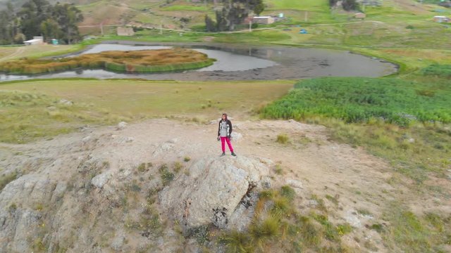 model male in awesome point view in the peruvian andes, wilcacocha lake.fly around.