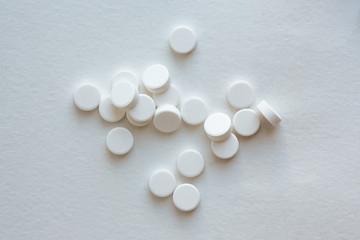 pills on white background. Top view. white tablets against coronavirus. Covid-2019. Covid-2020