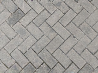 Stone pavement texture. Granite cobblestoned pavement background. Abstract background of old...