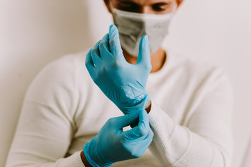 Man Wearing Latex Gloves and face mask