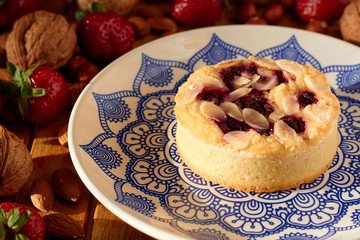 Mini tart cupcake with blueberries on plate. Close up