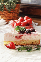Fresh delicious dessert with berries and green decoration, sweet food, tea time
