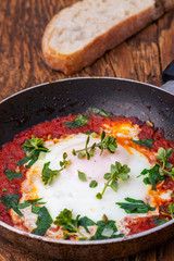 shakshuka in a pan on wood
