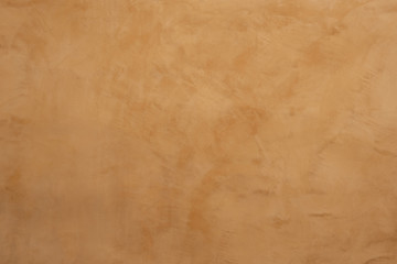 The surface of the wall with the old paint. The background of weathered painted wall. Texture of old plaster wall. Abstract background 
