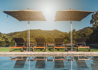 Pool chairs beside the pool