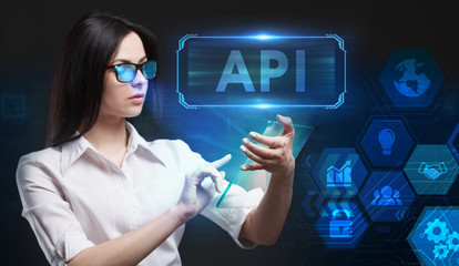 Business, Technology, Internet and network concept. Young businessman working on a virtual screen of the future and sees the inscription: API