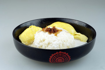 'Pulut Durian' is a glutinous or sticky rice with durian, coconut milk and sprinkle of grated palm sugar-selective focus