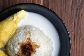 'Pulut Durian' is a glutinous or sticky rice with durian, coconut milk and sprinkle of grated palm sugar-selective focus