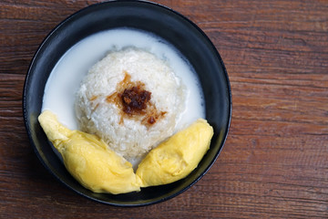 'Pulut Durian' is a glutinous or sticky rice with durian, coconut milk and sprinkle of grated palm sugar-selective focus