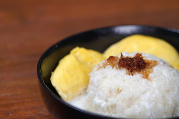 'Pulut Durian' is a glutinous or sticky rice with durian, coconut milk and sprinkle of grated palm sugar-selective focus
