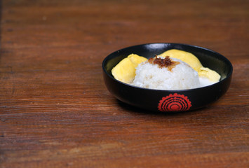 'Pulut Durian' is a glutinous or sticky rice with durian, coconut milk and sprinkle of grated palm sugar-selective focus