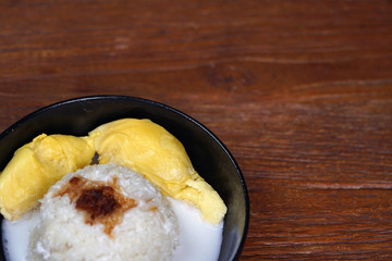 'Pulut Durian' is a glutinous or sticky rice with durian, coconut milk and sprinkle of grated palm sugar-selective focus