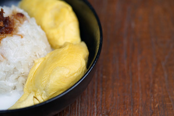'Pulut Durian' is a glutinous or sticky rice with durian, coconut milk and sprinkle of grated palm sugar-selective focus