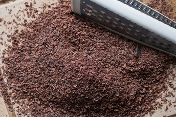 Grated chocolate. Selective focus. Close up, top view.