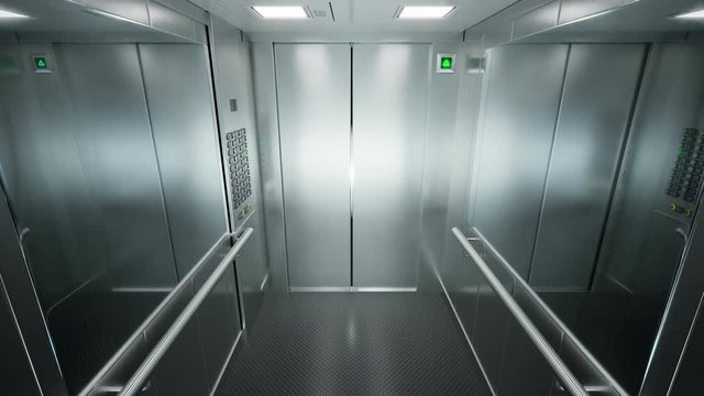 Empty, modern elevator with brushed steel walls traveling upwards in a loop 4KHD