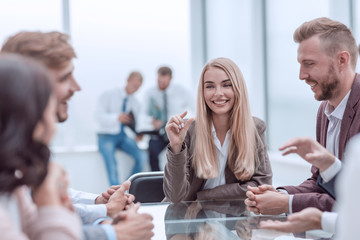 young business woman discusses her ideas with a business team.