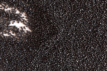 Close-up of plastic polymer granules. hand hold Polymer pellets. polymer plastic. compound polymer.