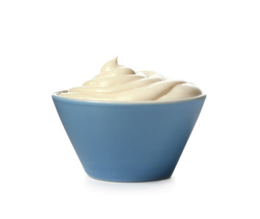 Bowl with tasty cream cheese on white background
