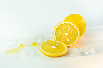 Fresh lemon iced with lemon sliced on white background.