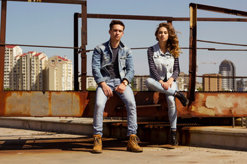 Fototapeta na wymiar Young couple man and woman in jeans clothes at daylight