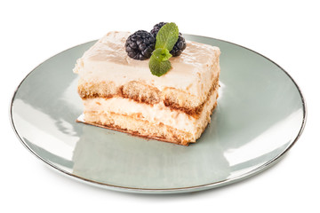 Plate with tasty tiramisu on white background