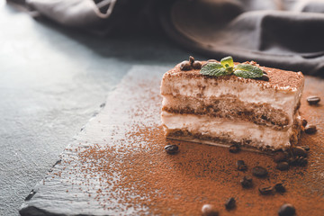 Tasty tiramisu on slate plate